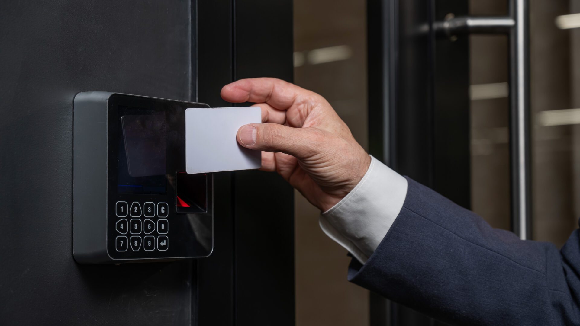 A man opens the door with a card. Modern electronic lock. Keyless Entry woman_with_card_reader